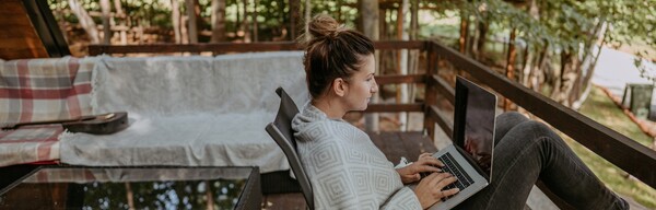 Person sitting by on porch working